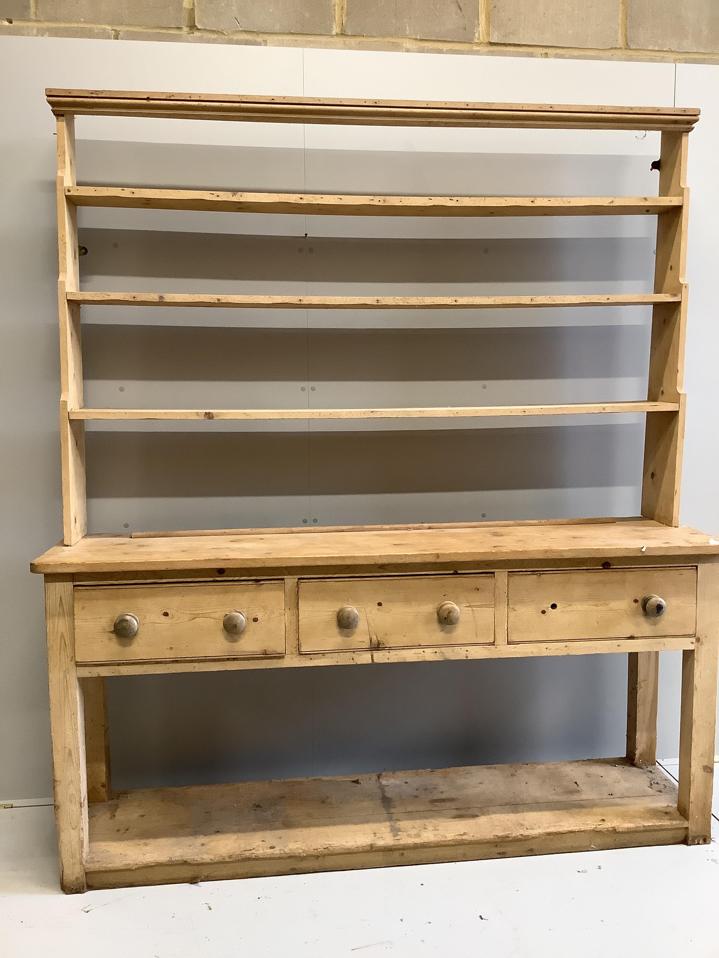A Victorian pine kitchen potboard dresser with open rack, width 190cm, depth 49cm, height 214cm